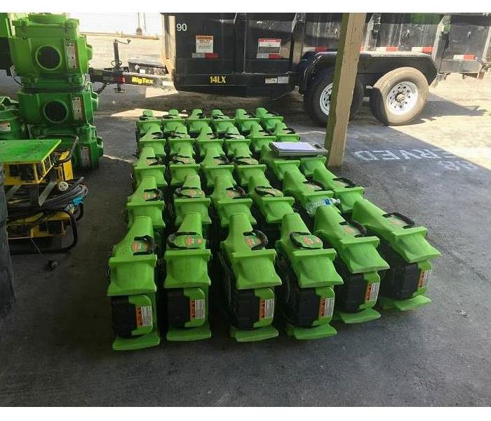 Air circulators lined up ready to be packed into truck