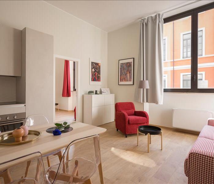 apartment with red accent furniture